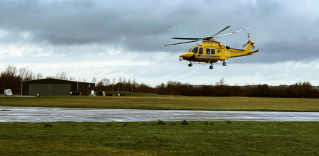 air ambulance flying in field