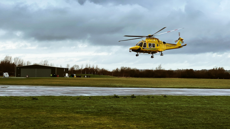 air ambulance flying in field