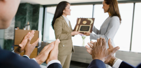 Professional women receiving awards